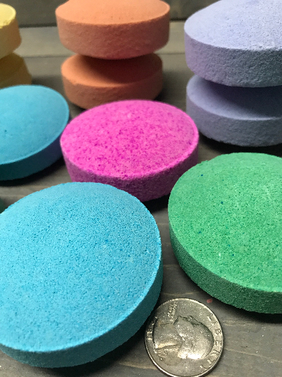 A photo showing various sizes and colors of shower steamers