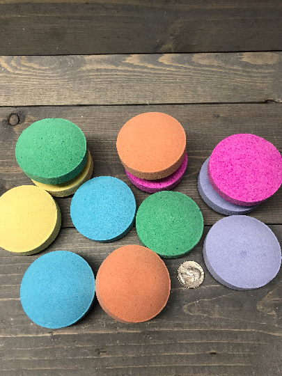 A photo showing various sizes and colors of shower steamers