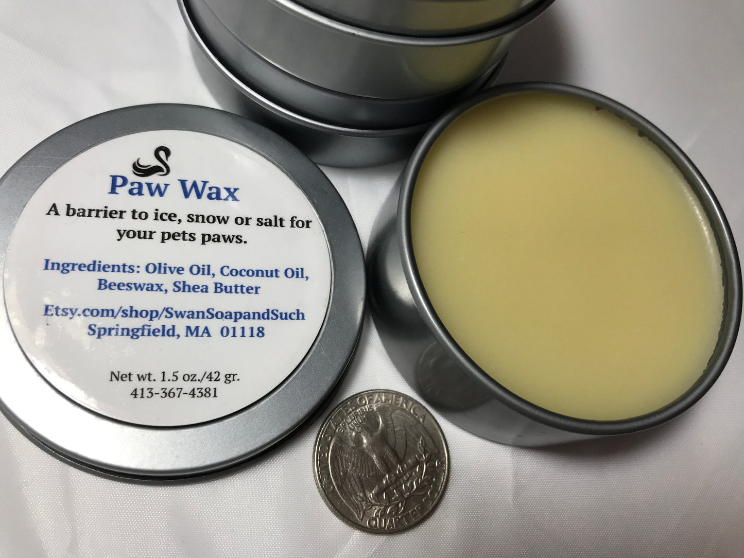 A photo showing a container of Paw Wax Paw Balm