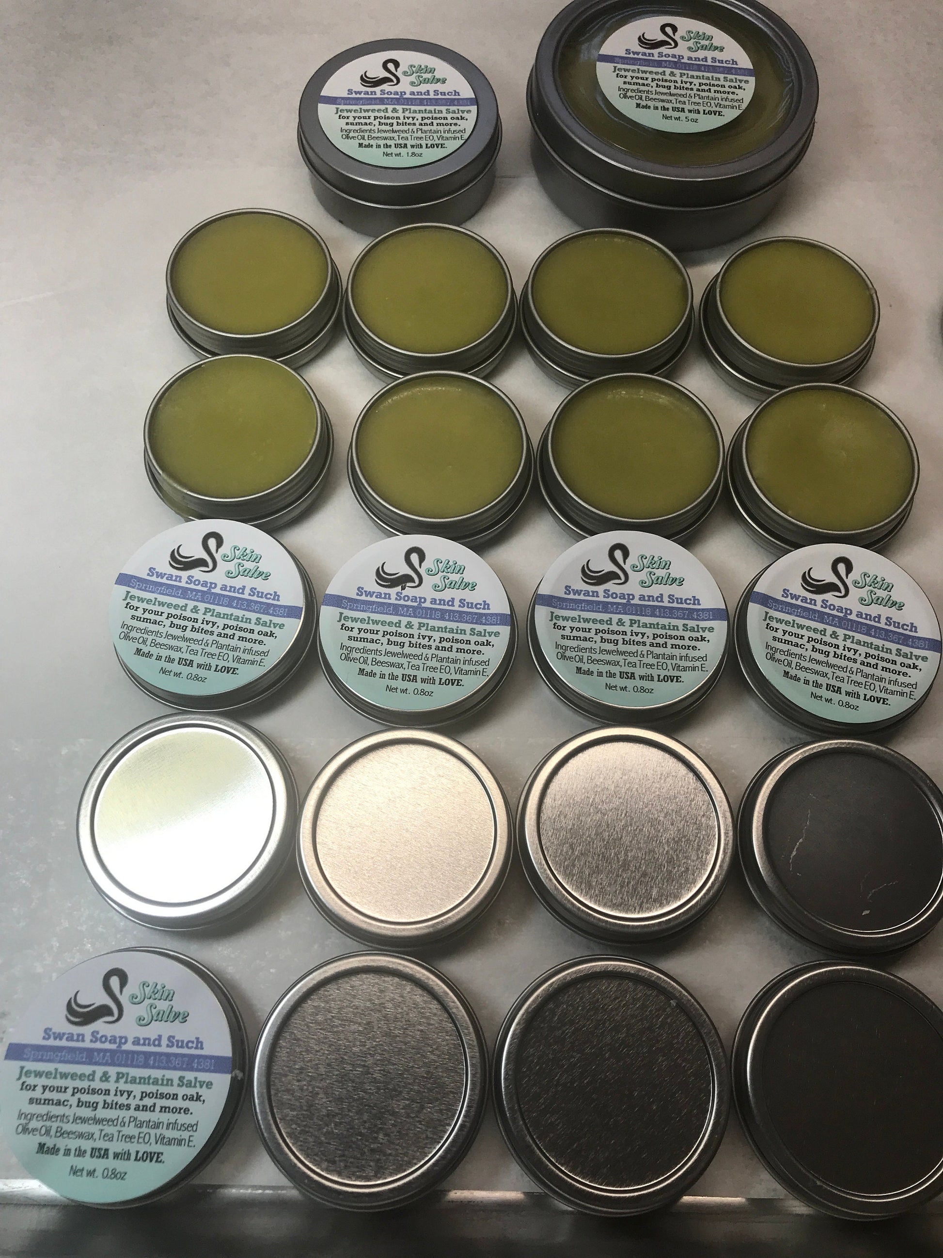 A photo showing a container of Jewelweed and Plantain Salve Balm