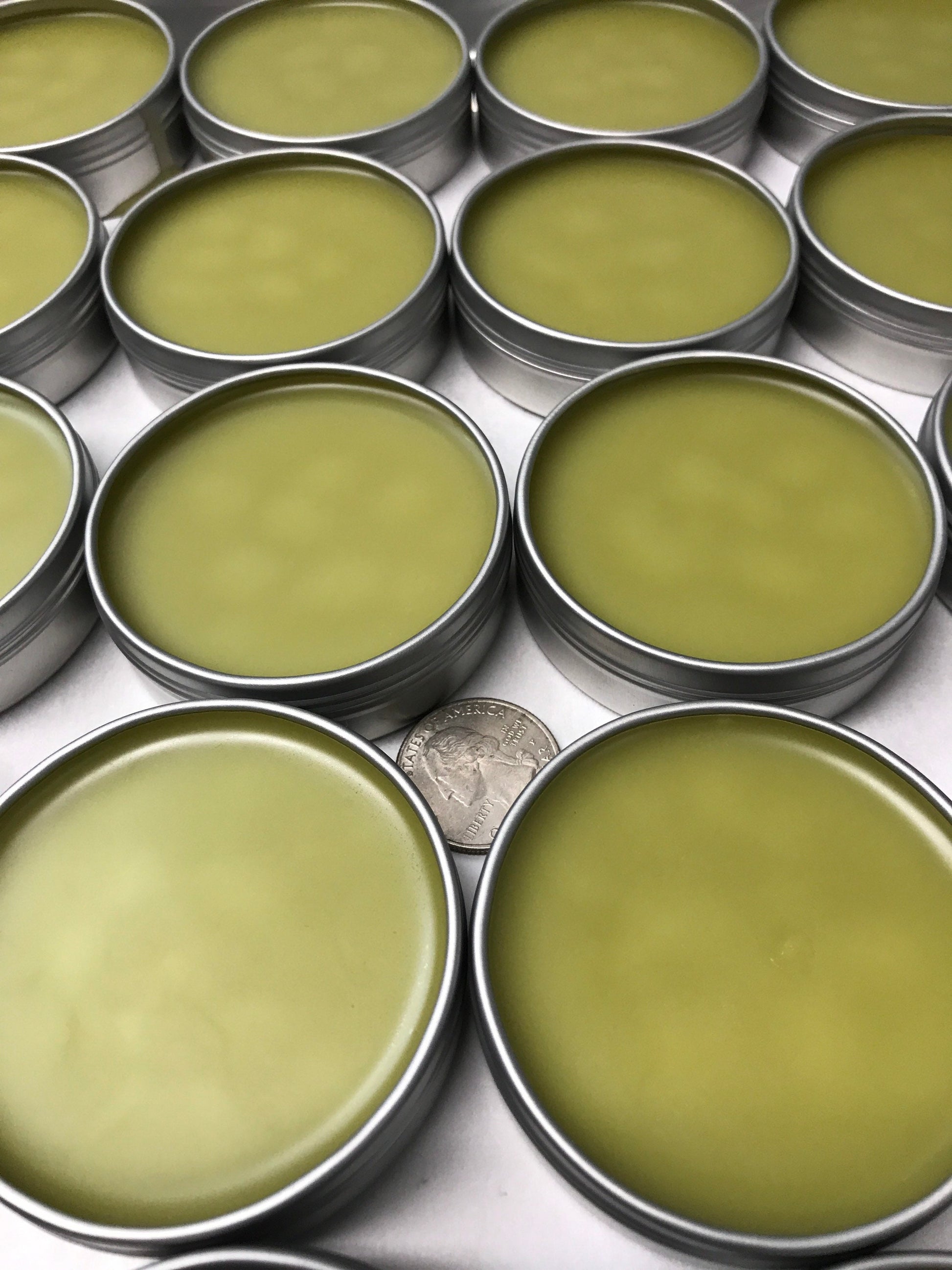 A photo showing a container of Jewelweed and Plantain Salve Balm