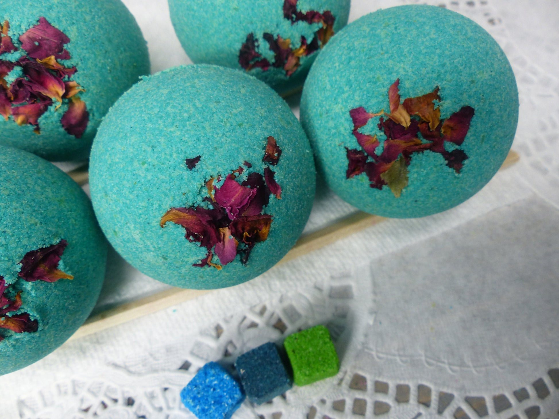 A photo of Bath Bomb - Breathe Bath Bomb with teal color, accented with potpourri 