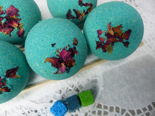 A photo of Bath Bomb - Breathe Bath Bomb with teal color, accented with potpourri 