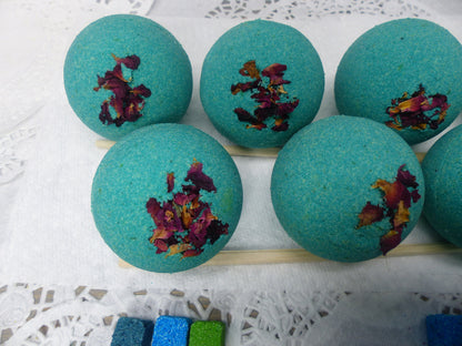 A photo of Bath Bomb - Breathe Bath Bomb with teal color, accented with potpourri 