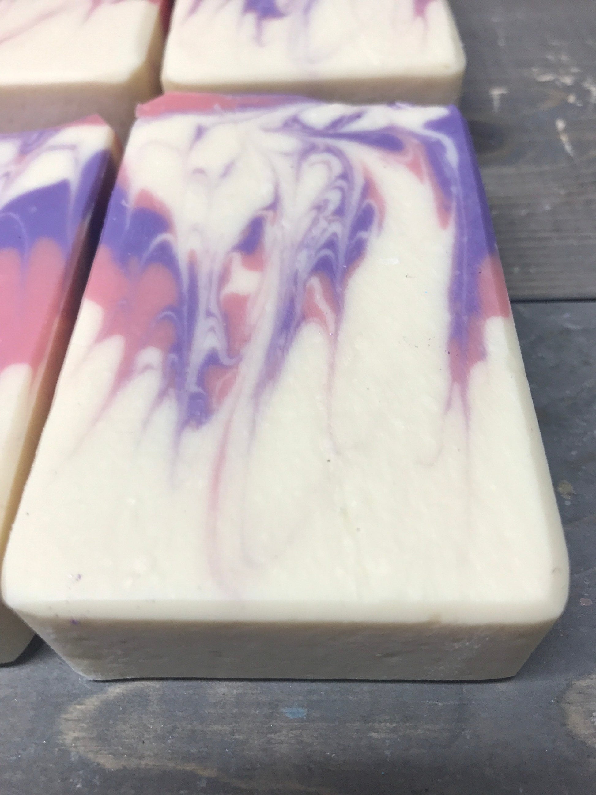 A photo of Honeysuckle Jasmine Soap with suttle amounts of purple and pink
