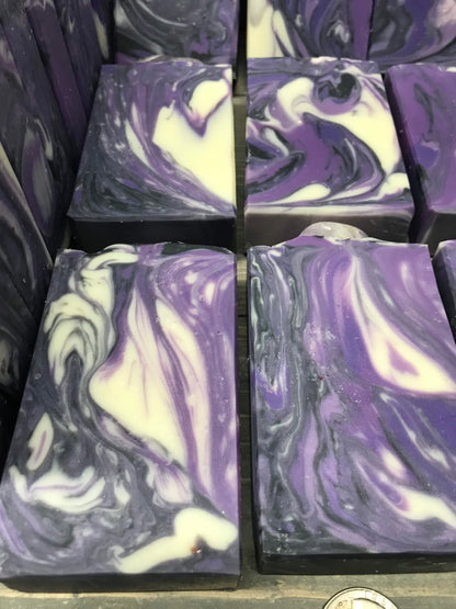 A photo of Lavender Martini with Banded Amethyst Stone on top of Bar Soap