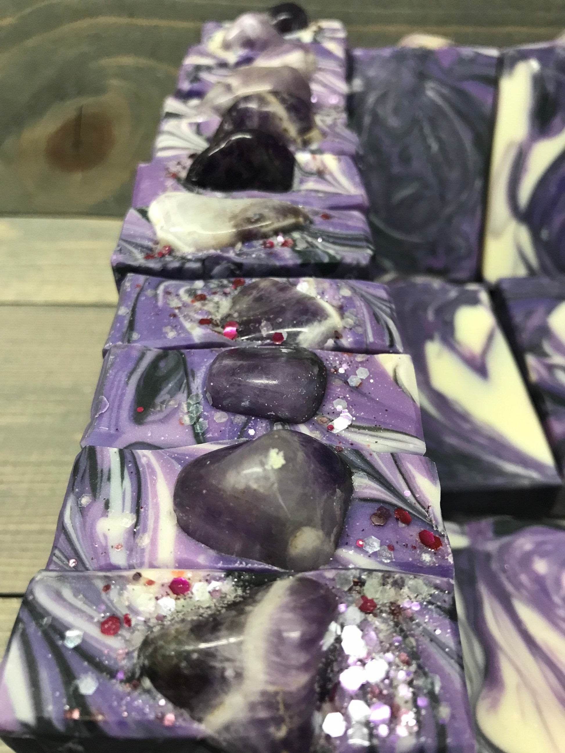 A photo of Lavender Martini with Banded Amethyst Stone on top of Bar Soap