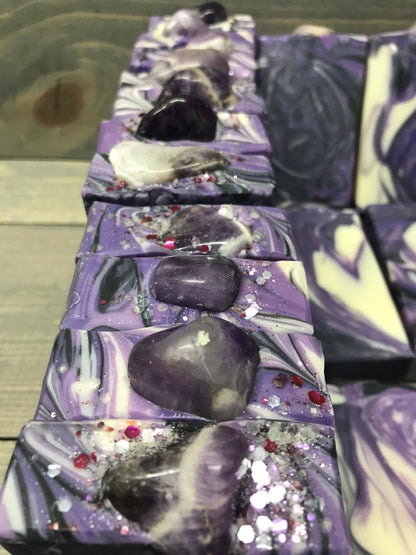 A photo of Lavender Martini with Banded Amethyst Stone on top of Bar Soap