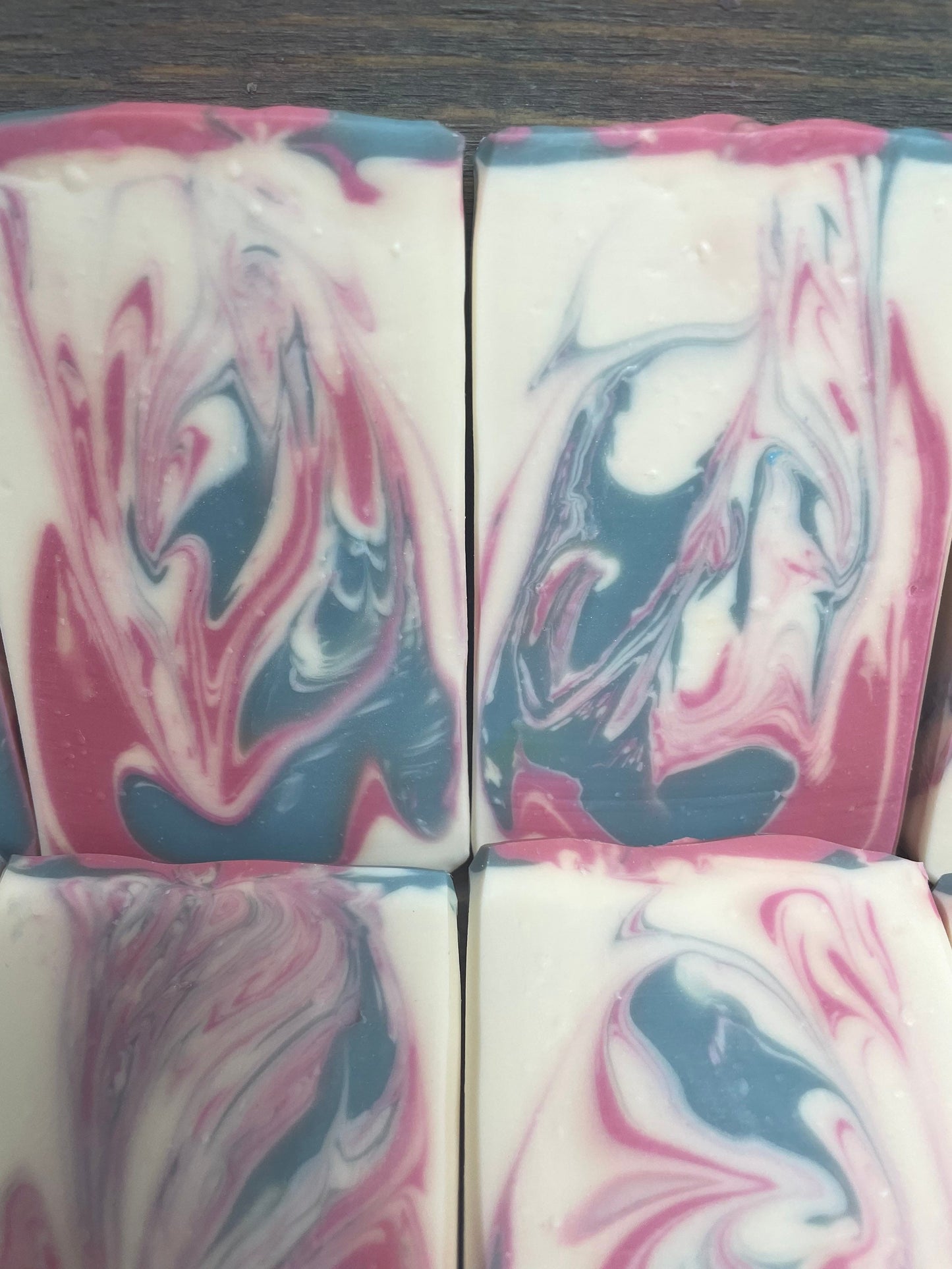a photo of Angel soap with red, black and white swirls