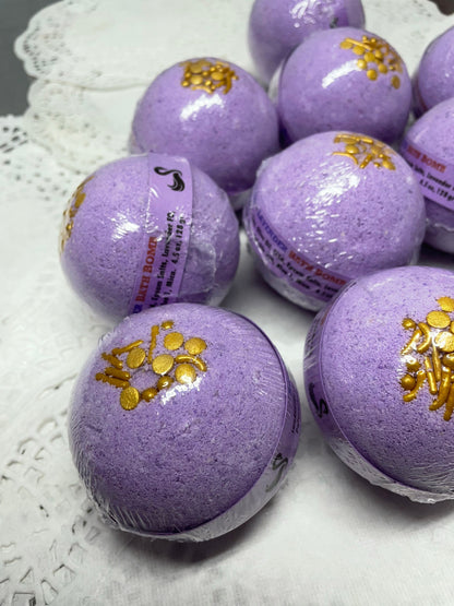 a photo of Lavender Bath Bombs with Embeds of colors topped with gold sugar sprinkles in lavender pastel colors