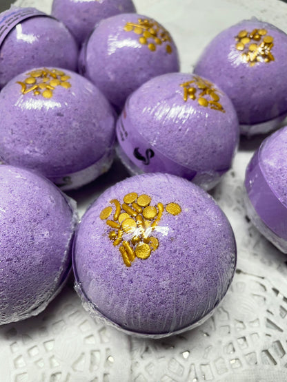 a photo of Lavender Bath Bombs with Embeds of colors topped with gold sugar sprinkles in lavender pastel colors