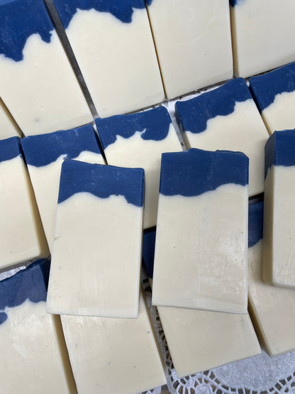 A photo of Aunt Pat’s Soap with a creamy color base, topped with a royal blue color