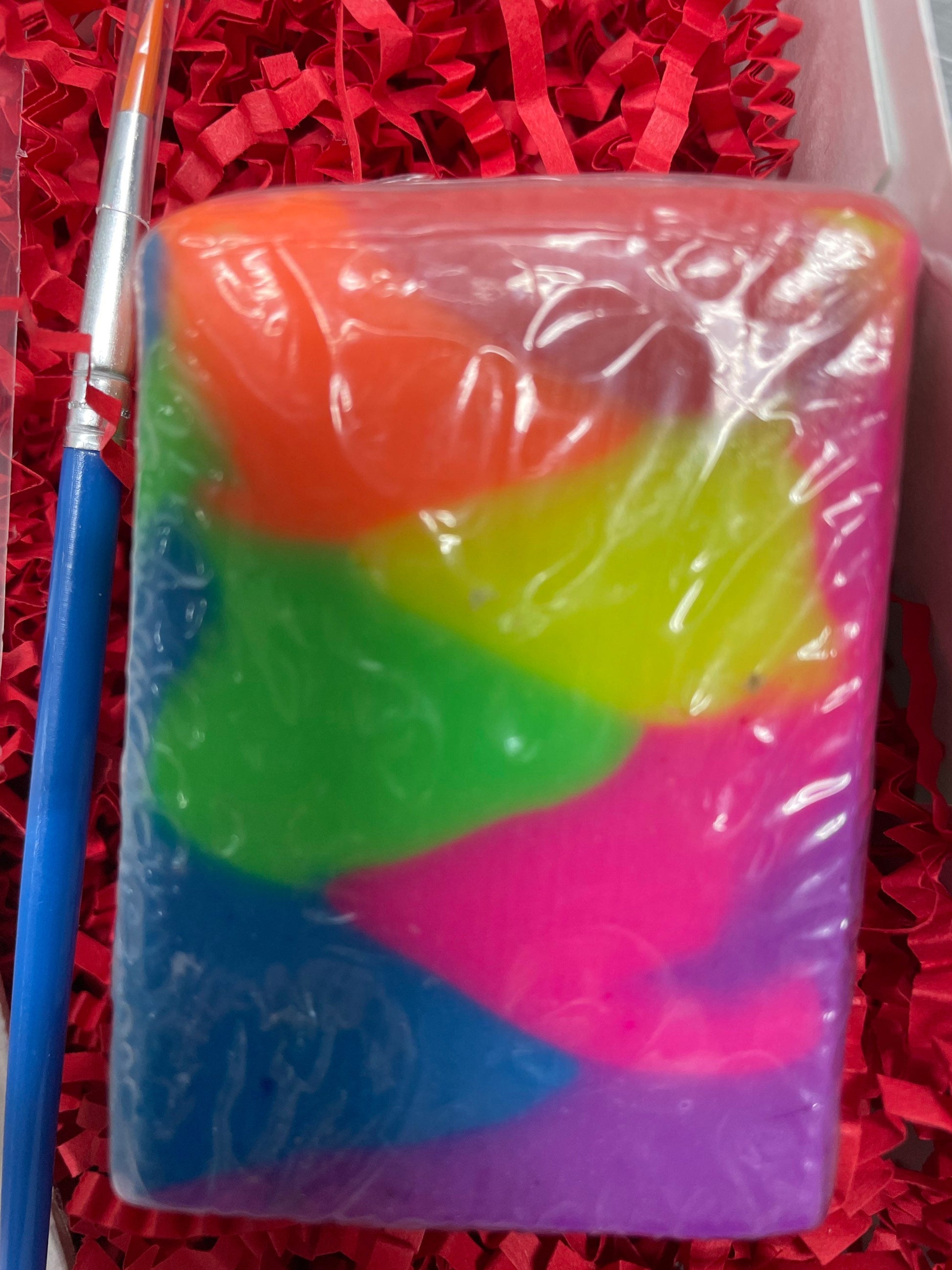 A photo of a rainbow colored soap.