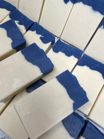 A photo of Aunt Pat’s Soap with a creamy color base, topped with a royal blue color