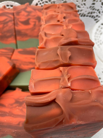 A photo of several Cranberry Orange Soap bar soap.