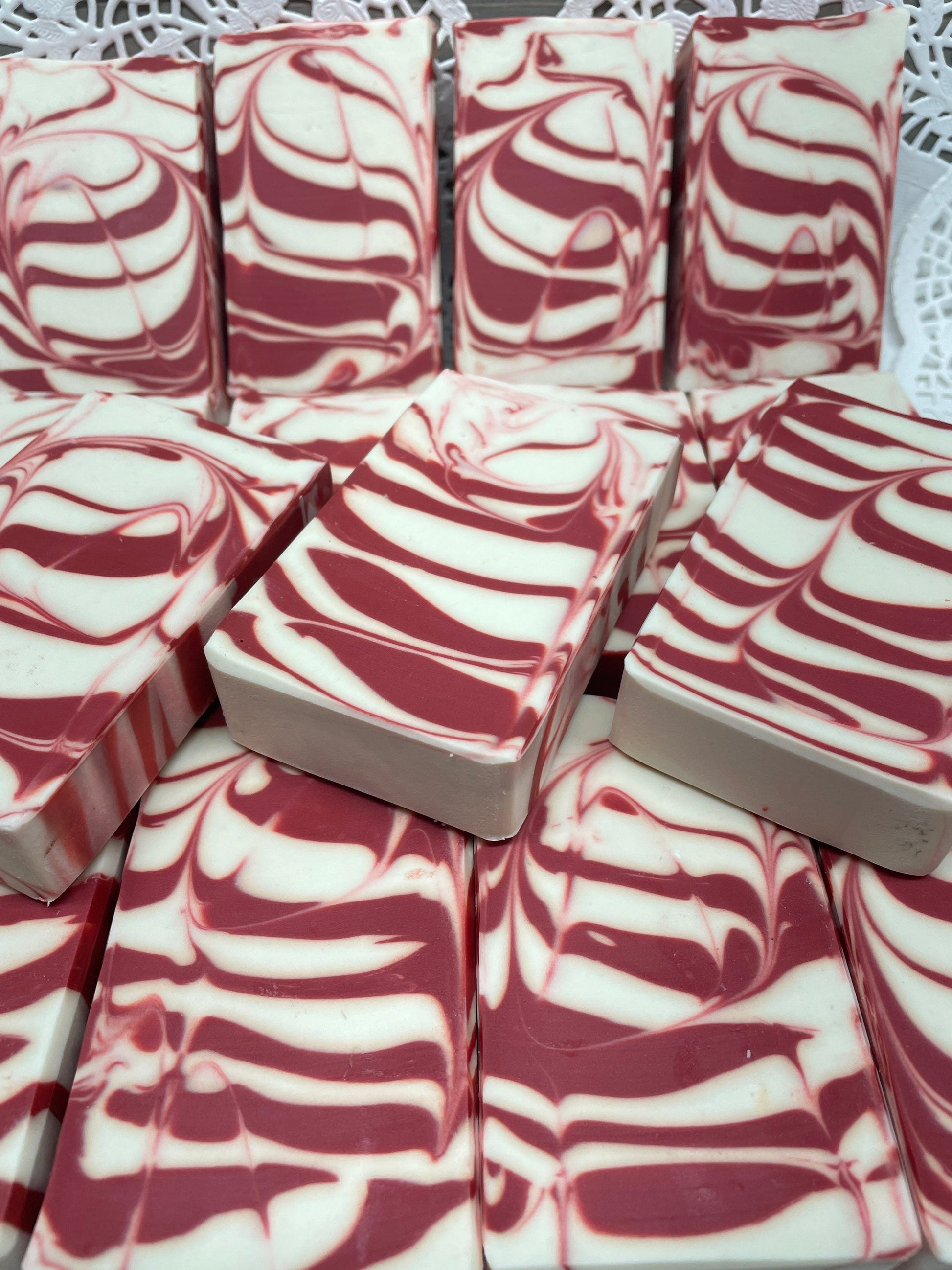 a photo of Candy Cane Soap with Peppermint Essential Oil that is striking red and white striped soap