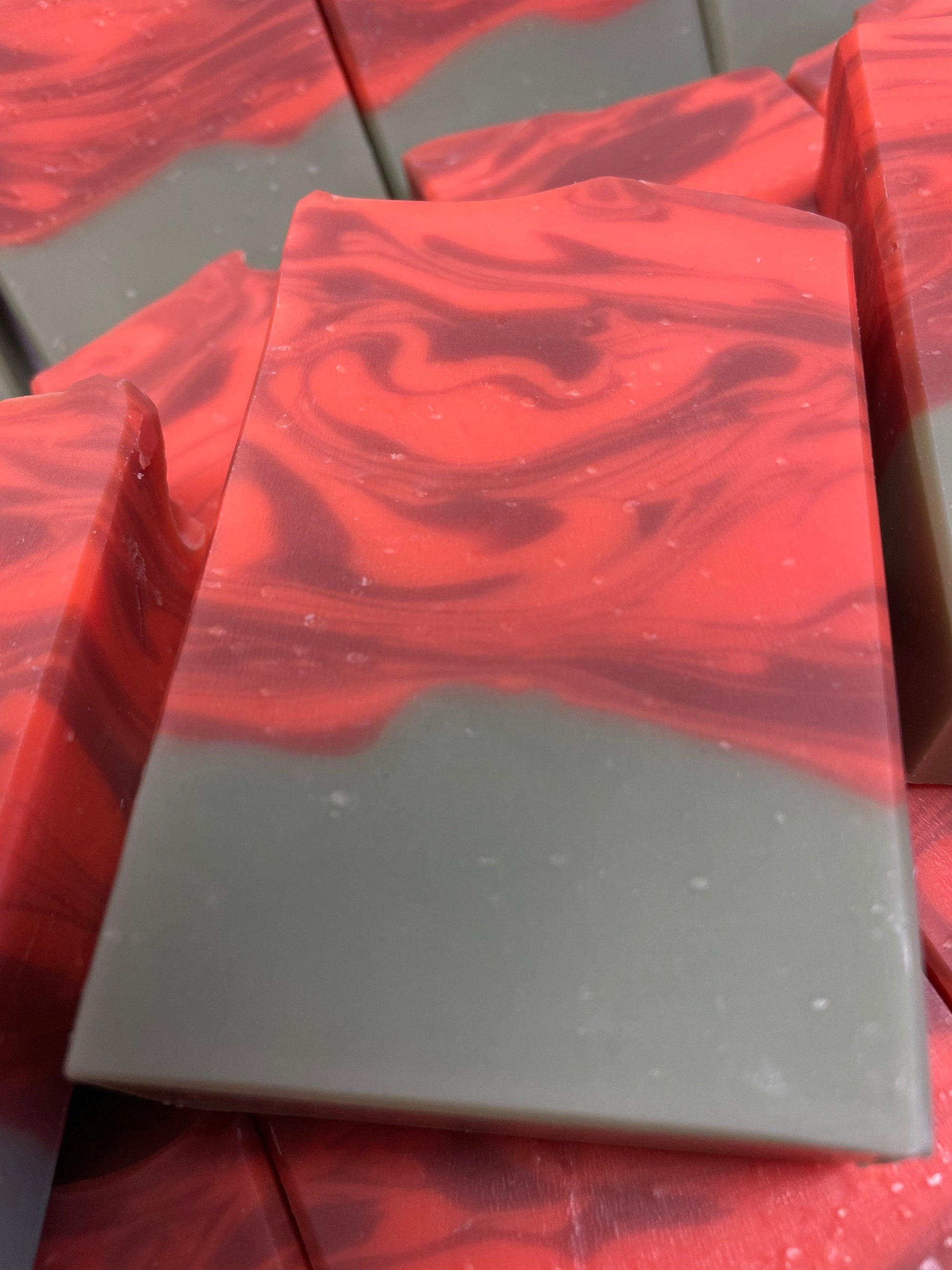 A photo of several Cranberry Orange Soap bar soap.