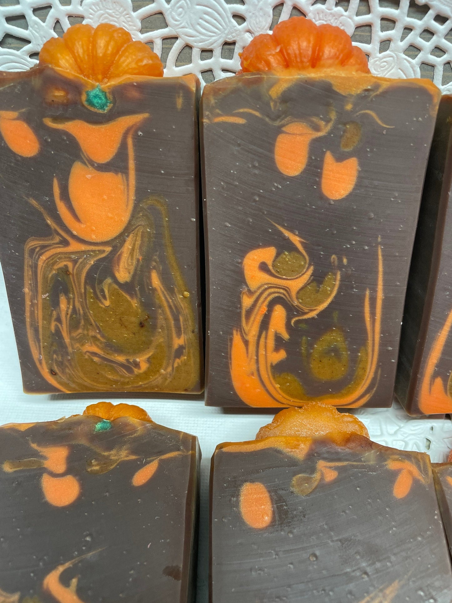 A photo showing Pumpkin Spice Soap Soap with brown and orange colors