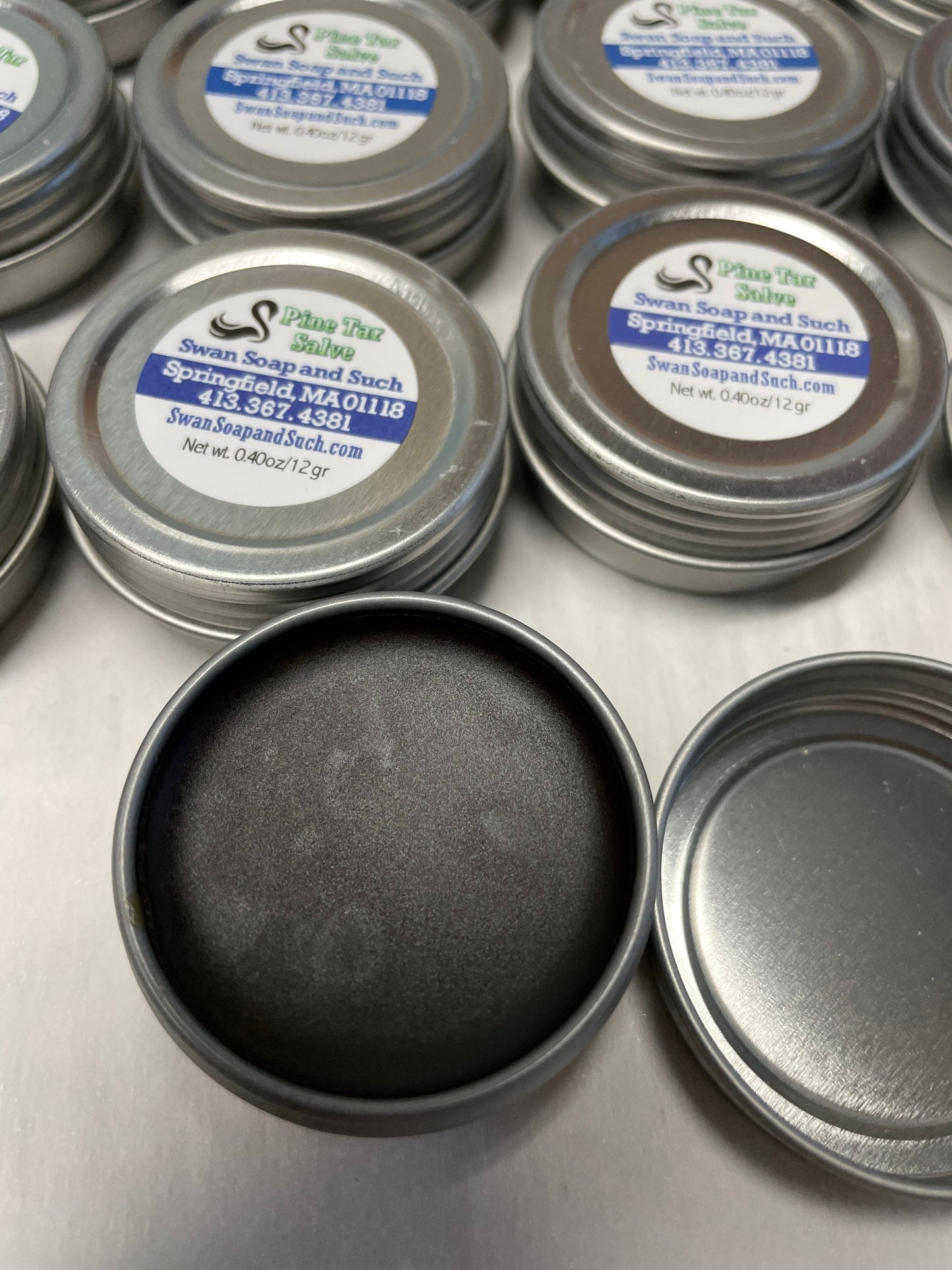 A photo showing a container of Pine Tar Salve